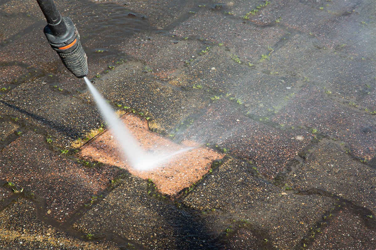 Pressure Washer Cleaning Driveway
